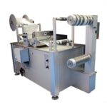 Cut to length station unwinds, slits, cuts and rewinds acrylic material in roll form