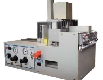 Crush cut slitter station with punch and feeder punches and cuts laminated plastic cards