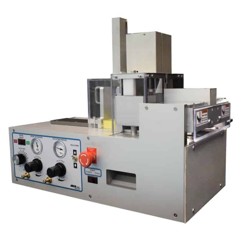 Crush cut slitter station with punch and feeder punches and cuts laminated plastic cards
