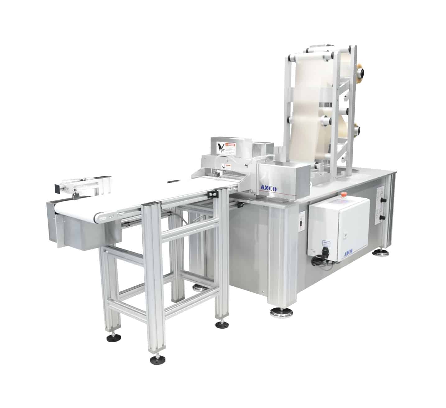 Complete system unwinds, feeds, punches, and cuts PVC film